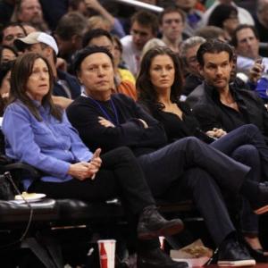 Actor Billy Crystal and producer Mark Stewart attend the game between the Los Angeles Clippers and the Minnesota Timberwolves at Staples Center on April 10, 2013 in Los Angeles, California.