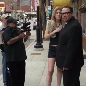 Behind the scenes photo on set for the Movie Sydney outside the famous Esquire Theater in Cincinnati Ohio Actress Iabou Windimere portraying a 16 year old street walker hits on the main Character Sydney 2011 Broke Filmmaker Studios A M