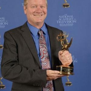 John Horrigan with a 2014 Boston/New England Emmy Award for 