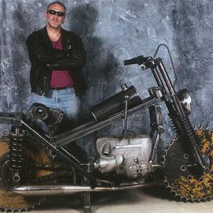 Sculptor Bruce Gray with his Motorcycle sculpture made from train parts and a BMW motorcycle engine