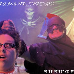 Mr Torture and Miss Misery on the Tv set of Miss Miserys Movie Massacre