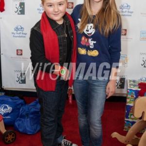 STUDIO CITY, CA - DECEMBER 08: (L:R) Zachary Alexander Rice and Recording Artist Lauren Suthers attend 'Kids Helping Kids' - A Celebrity Holiday Stuff-A-Thon Benefiting My Stuff Bags Foundation at CBS Studios - Radford on December 8, 2012 in Studio City, California.