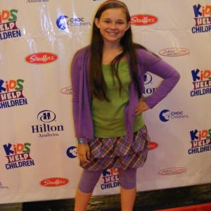 Cassie Earl on the red carpet at the Kids Help Children event in Anaheim, Calfornia