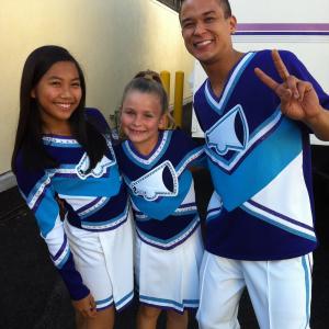 on the set of Fresh Beat Band Nickelodeon in cheer uniforms!