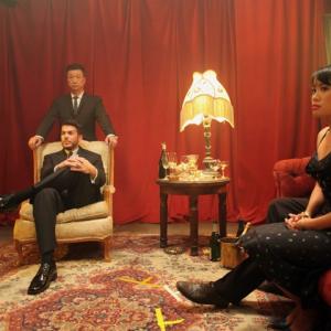 On set Photo of Bradley Castillo, Tzi Ma, and Vyvy Nguyen in Made in Chinatown.