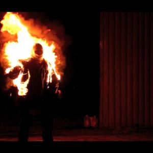 Still of Ian McMurray in fire burn stunt.