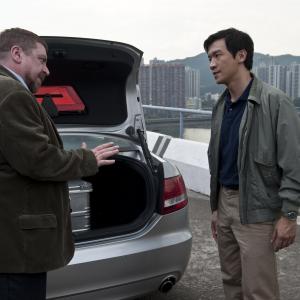 Still of Armin Rohde and Chin Han in Uzkratas (2011)