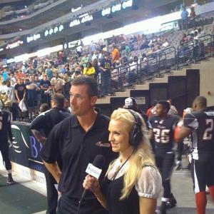 Erin Marie Garrett sideline reporter for Time Warner Cable Sports broadcast of AFL Dallas Vigilantes game.