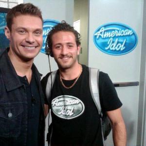 Ryan Seacrest with Vito Grassi while working on American Idol