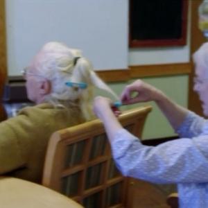 Attempting to roll the hair of a fellow Alzheimer patient in Still Alice