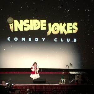 Rosanna presenting her funny monolog at Inside Jokes Comedy Club on the stage of Famous Chinese Theater Christmas costume custom designed and made by Oxana Foss