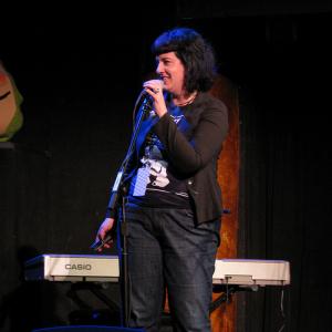 Bonnie Burton performing on stage at w00tstock in San Francisco