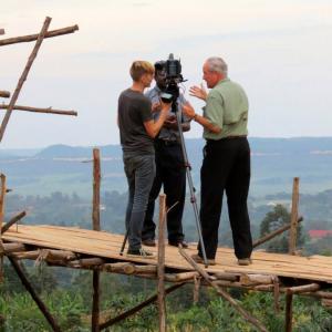 Consulting with my Road to Hope DP Tim Wolfer regarding the best way to shoot from this rather precarious position in Southeastern Uganda What a view!