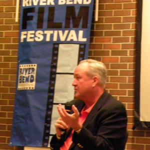 Responding to audience questions during a filmmaker QA session following a film screening at the River Bend Film Festival
