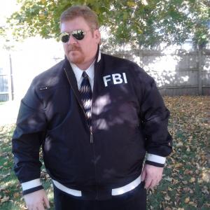 Darren Marlar as FBI Agent James Cook in the series Adrien England