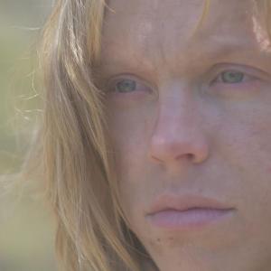 Still from the post short film Living in the Grave Directed by Evan Weidenkeller A young woman discovers hope as one of the last human survivors in a desolate postapocalyptic world