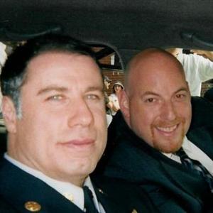 Andrew Aninsman and John Travolta on the set of Ladder 49 Funeral Scene
