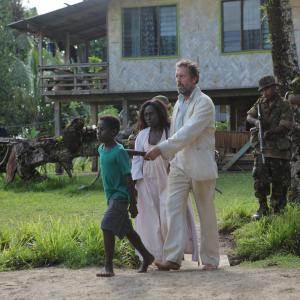 Still of Hugh Laurie and Florence Korokoro in Mr. Pip (2012)