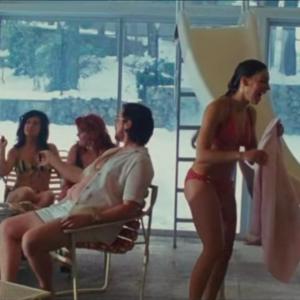Screenshot of Alexis Capozzi alongside Christian Bale in American Hustle