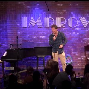 Johnno Wilson performing at The Hollywood Improv