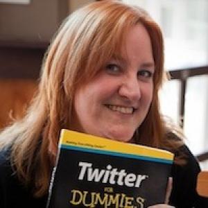 Leslie Poston, co-author, holding Twitter for Dummies