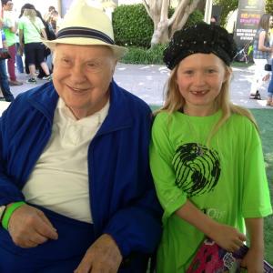 Actress Abigail Zoe Lewis with Reuben Klamer Inventor of the game of Life Attends Points of Light generationOn Block Party on April 18 2015 in Los Angeles California
