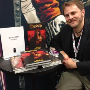 Daniel Corey signing copies of his MORIARTY Deluxe Edition Hardcover at the Image Comics booth, San Diego Comic-Con 2013.