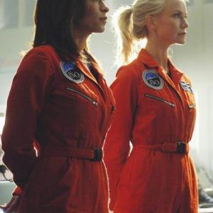 Still of Christina Cox and Laura Harris in Defying Gravity 2009