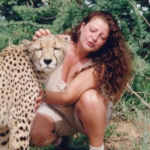 Lynn Santer with rescued cheetah in The AfriCat Foundation Namibia, Africa