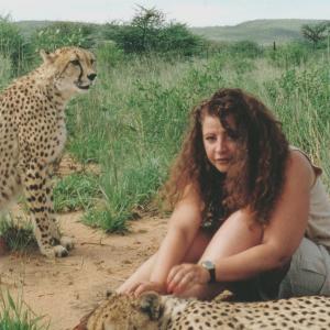 Lynn Santer with Cheetahs in The AfriCat Foundation Namibia Africa