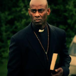 Rudy Barrow as Father Jan in Exorcist Chronicles