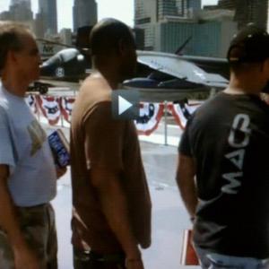 USA channel showing the TV hit Royal Pains In this snap shot you see me in the black shirt shaking hands with one of the leads on top of the Intrepid of New York playing a war vet