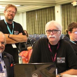 Rob McConnell, Executive Producer of the Alien Cosmic Expo PPV TV broadcast(right), Steve Benedict, Director (center) and Stanton T Friedman (left)