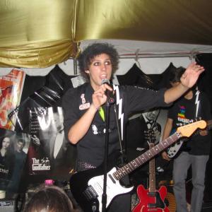 Cameron singing with his band 