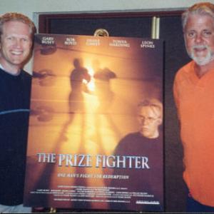 Jeff Howard l and Mark Mason r with a poster for their film The Prize Fighter