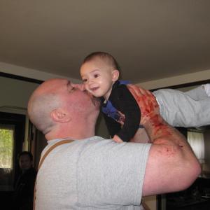 Michael Patrick Stevens on the set of Brutal with his son, baby Micah.