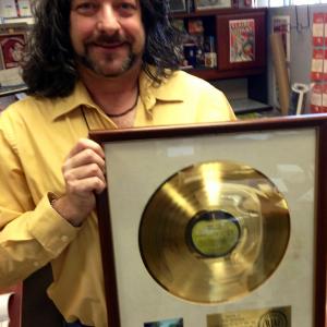Greg the Pop Culture Guru with the Gold Record for the Beatles Abbey Road