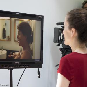 Director Jenny Anastasoff watches 'Sui Generis' lead Lisa Boucher Hartman on the monitor. Phil Cormier frames the shot. 2014.