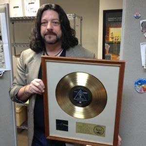 Greg with the Gold Record for Pink Floyds Dark Side of the Moon album
