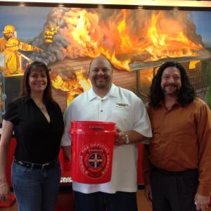 Greg and his wife Lisa with Robin Sorenson founder of Firehouse Subs