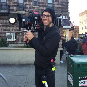 Holding onto the A Camera on Breaking Brooklyn between takes