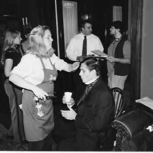 1. Tom Currá, speaking with the AD in make-up on location with United Studios, while wardrobe designer & makeup artist, Jenny Brotherton works on actor, Frank Rempe who played, John Mitchell in the film, Stories from the Mines.