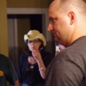 Director Jeffrey Parker discusses a scene with Leatherface actor RA Mihailoff and animal trainer Chad Lovelady and SFX artist Karen Wine