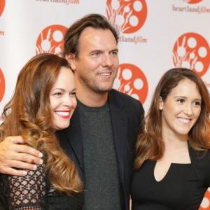 Sunny in the Dark producer Shanda Munson left and cast members Jay Huguley and Hannah Ward pose for photos at the opening night of the Heartland Film Festival and premiere of Room Friday Oct 16 2015