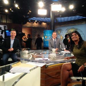 Tom McLaren being interviewed on CBS This Morning with anchors Anthony Mason and Vinita Nair on October 25 2014