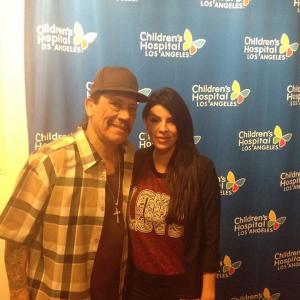 Danny Trejo and Brenda Pond volunteering at the childrens toy driveblood donation event 2014