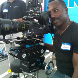 Bruce B Gordon examining monitoring on an ARRI Alexa camera at a J L Fisher event for the Society of Camera Operators SOC International Cinematographers Guild ICG and American Society of Cinematographers ASC
