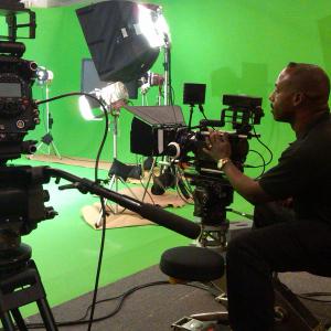 Director Bruce B Gordon surveying RED camera set up for a green screen SFX shoot