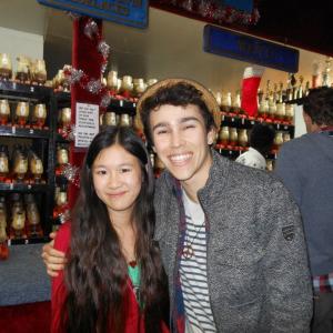 Actress Tina Q Nguyen and actorsinger Max Schneider at the Pastrys Skate Event in December 2012