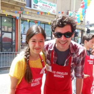 Actress Tina Q Nguyen and actor Brendan Robinson Pretty Little Liars volunteers at the Los Angeles Missions End of Summer Block Party on August 25 2012
